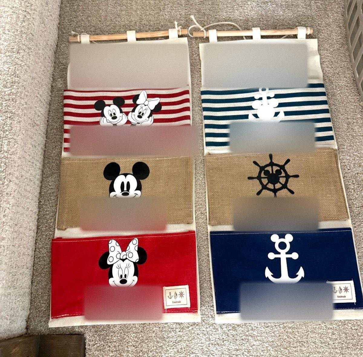 Two fish extenders side by side, one in red stripes and one in navy stripes